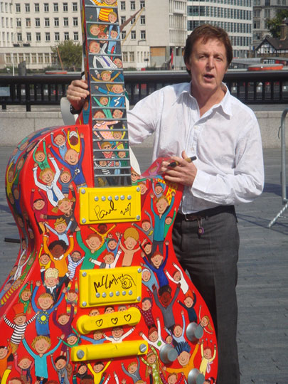 Sir Paul McCartney and his 10 foot hand painted Gibson